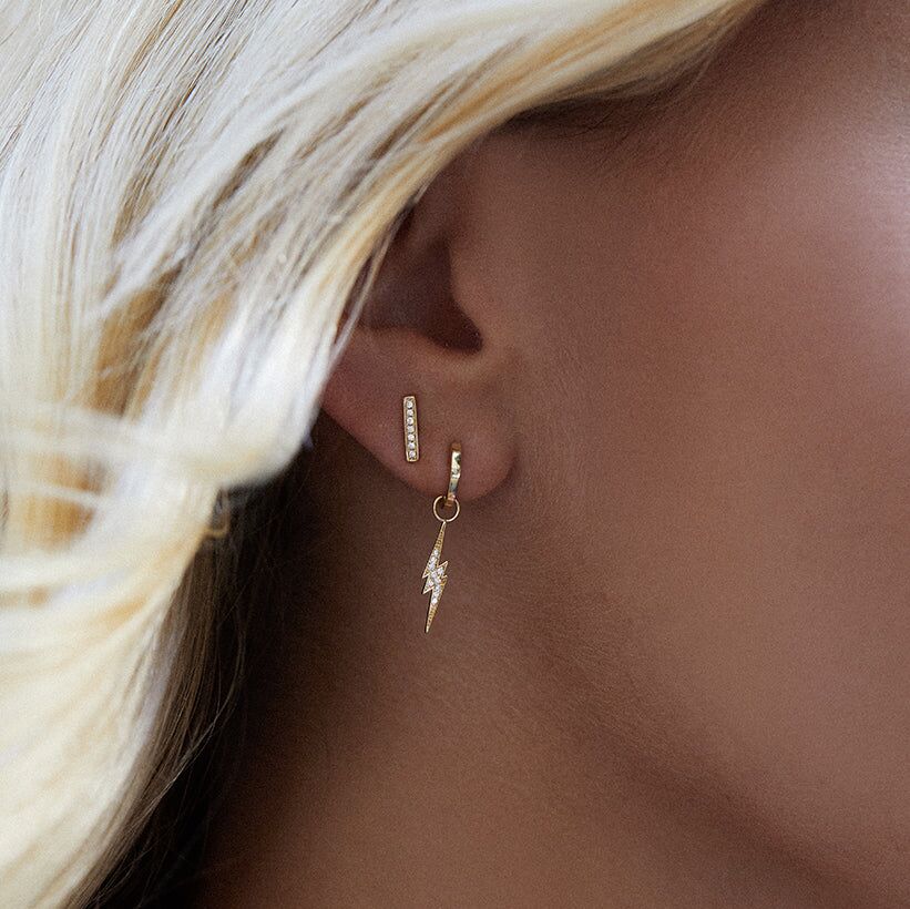 gold huggie hoop and lightning bolt charm hoops 2