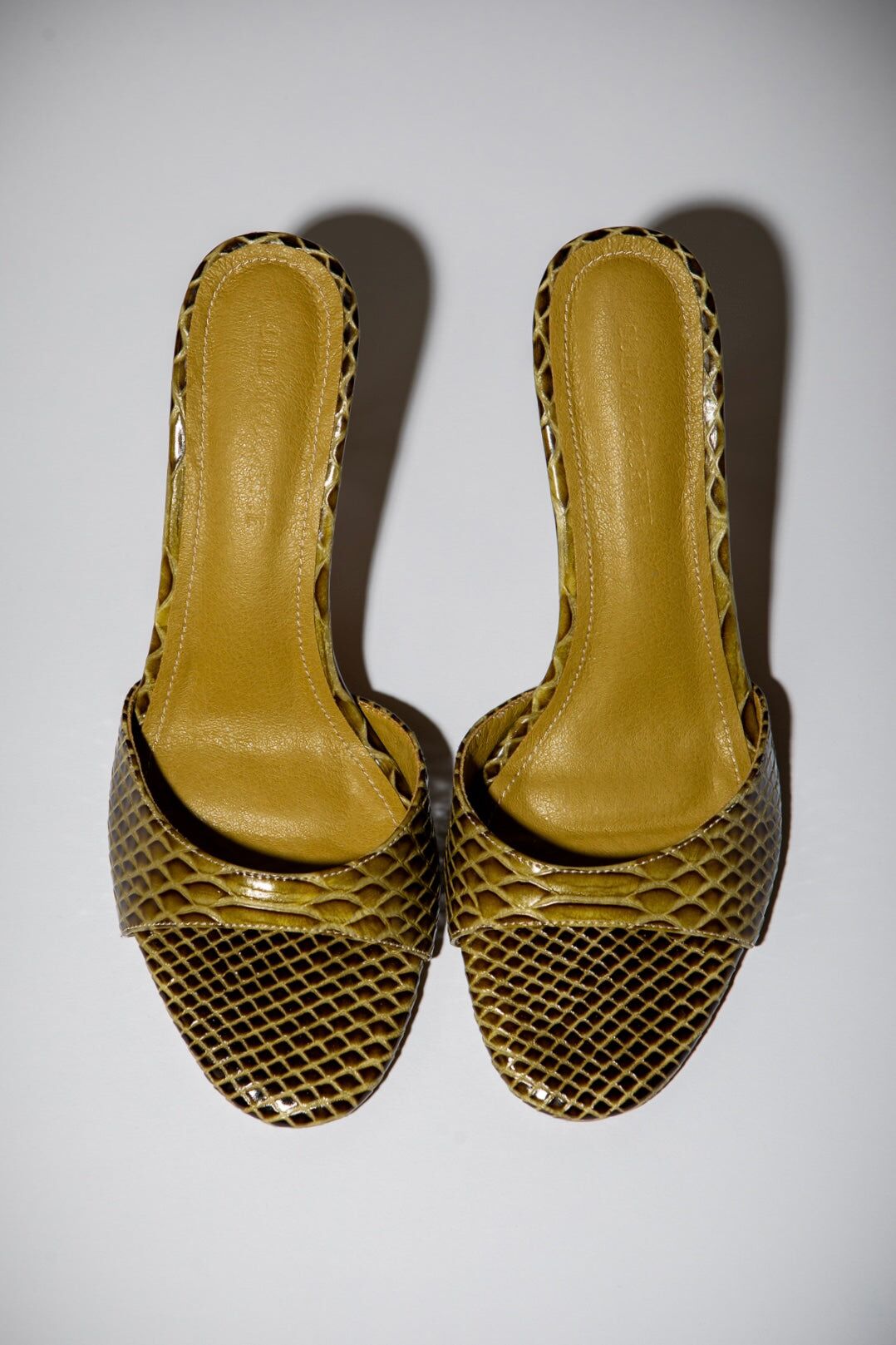 nour olive snake mules 1